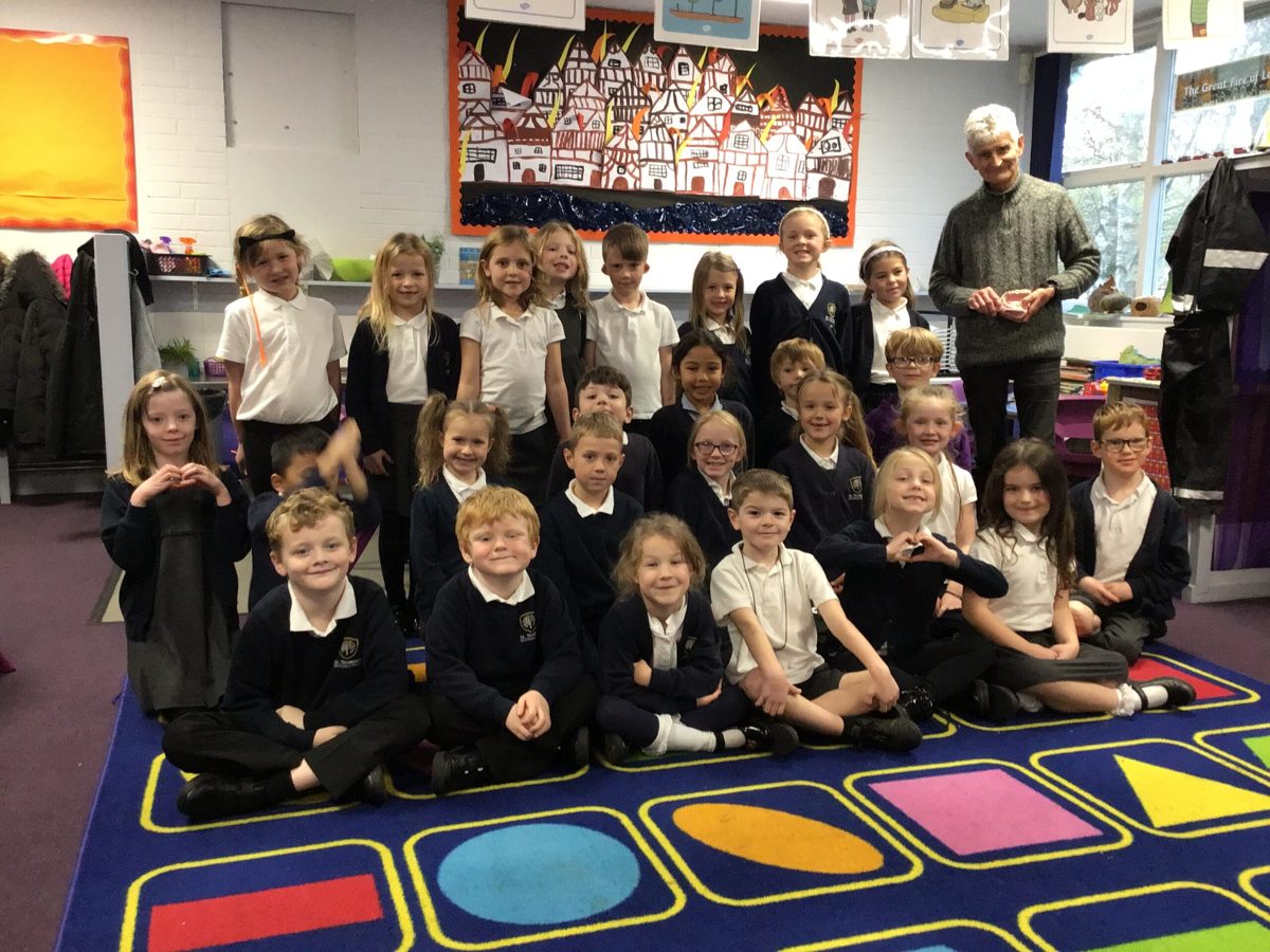 Class photo with a visitor