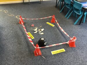 A pretend investigation scene set up in the classroom