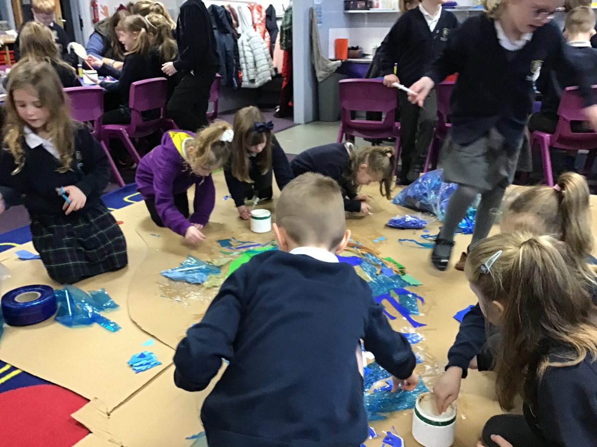 Pupils working on a group art project