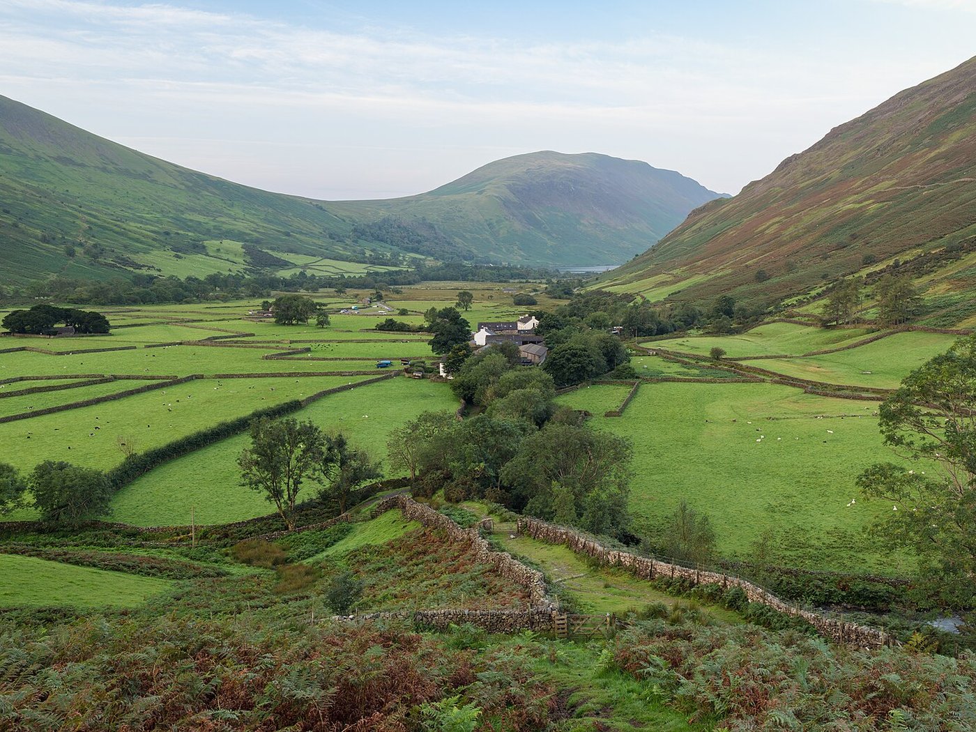 Green fells, drystone walls and farm fields in the Lake District, Cumbria