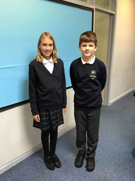 Two pupils in school uniform